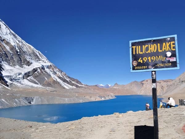 Crystal Clear Turquoise Tilicho Lake Nestled Among Rugged Himalayan Peaks