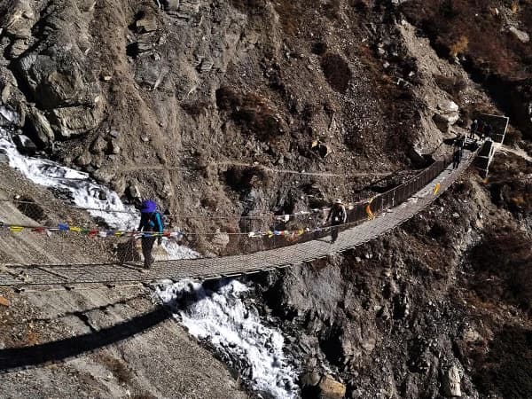 On The Trek To Tilicho Lake A Suspension Bridge Is A Significant Landmark