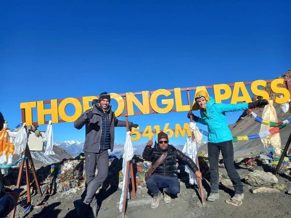 Trekkers Celebrating At The Summit Of Thorong La Pass