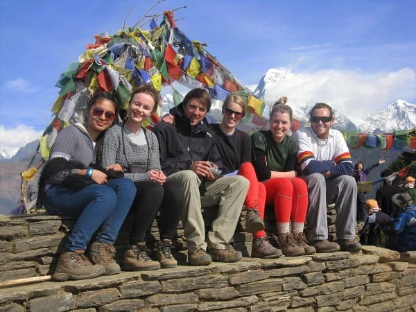 Trekkers Enjoying Annapurna Panorama Views From Ghorepani Deurali